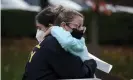  ?? Photograph: Gene J Puskar/AP ?? People hug on the sidewalk outside the Tree of Life synagogue in Pittsburgh on 27 October, the second anniversar­y of the shooting.