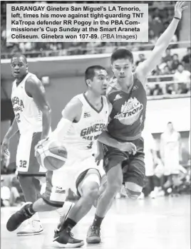  ?? (PBA Images) ?? BARANGAY Ginebra San Miguel’s LA Tenorio, left, times his move against tight-guarding TNT KaTropa defender RR Pogoy in the PBA Commission­er’s Cup Sunday at the Smart Araneta Coliseum. Ginebra won 107-89.