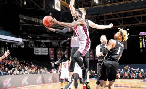  ?? STEVE WOLTMANN/UIC ATHLETICS ?? Looking at the bright side, UIC guard Marcus Ottey says the Flames have learned from their road losses at the start of the season.