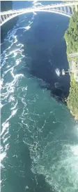  ?? PATRICK J. PROCTOR/ RAINBOW AIR INC., VIA AP ?? In this July 29 photo, black-coloured wastewater treatment discharge is released into water below Niagara Falls, in Niagara Falls, N.Y.