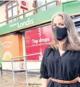  ??  ?? QUESTIONS FOR POST OFFICE LTD: Coun Melissa March outside the Londis and post office in Knighton Church Road, Leicester