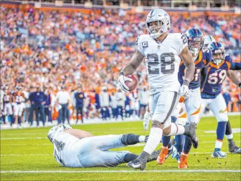  ?? L.E. Baskow
Las Vegas Review-journal @Left_eye_images ?? Raiders running back Josh Jacobs scores a TD against the Broncos in their first meeting on Oct. 17.