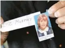  ?? BALTIMORE SUN FILE ?? Elizabeth Ann Murphy holds a picture of herself as a schoolgirl at Our Lady of Good Counsel School, where Merzbacher repeatedly raped her.