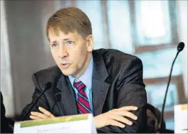  ?? Pete Marovich Getty Images ?? “WE CONTINUE to hear about serious problems with debt collection — debiting accounts without authorizat­ion,” CFPB Director Richard Cordray said.