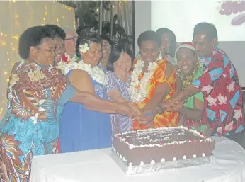  ?? . Photo: Warwick Fiji ?? Warwick Fiji staff cut the cake during the resort’s annual staff award night