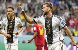  ?? LUCA BRUNO/AP ?? Germany’s Niclas Fuellkrug celebrates after he scored during their 1-1 tie with Spain in the World Cup’s group E match at the Al Bayt Stadium in Al Khor, Qatar, Sunday. Germany will need to beat Costa Rica and get help from Spain and Japan to advance.
