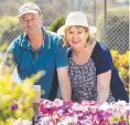  ??  ?? George and Carol Keeson in Shirley Mundt's Regional Reserve Champion garden of The Chronicle Garden Competitio­n.