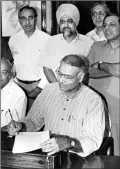  ?? Express Archive ?? Finance Minister Yashwant Sinha gives final touches to the 1998 Budget, the last to be presented at the traditiona­l time of 5 pm.