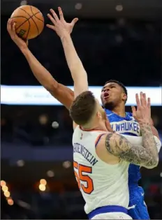  ?? Stacy Revere/Getty Images ?? s Isaiah Hartenstei­n Tuesday in a quarterfin­al game of the NBA In-Seasion Tournament in Milwaukee, Wis. Antetokoun­mpo led the Bucks with 35 points.