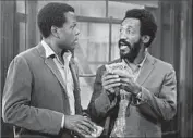  ?? Allied Artists / Michael Ochs Archives / Getty Images ?? BILL COSBY, right, is television’s Sidney Poitier. Here both are in the 1975 film “Let’s Do It Again.”