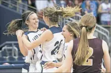  ?? Steph Chambers/Post-Gazette ?? Vincentian’s Marina Eyster and Caroline Elliott celebrate after winning the WPIAL Class 2A girls championsh­ip.