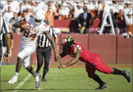  ?? RICARDO B. BRAZZIELL / AMERICANST­ATESMAN ?? Texas’ Lil’Jordan Humphrey picks up a first down Saturday as he eludes Maryland defensive back Qwuantrezz Knight. Humphrey was the top receiver for the Longhorns in the loss to the Terrapins, turning six catches into 82 yards.