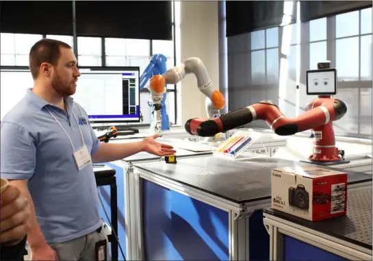  ?? CAMERON MORSBERGER — LOWELL SUN ?? Brian Flynn, test engineer at Umass Lowell’s NERVE Center, demonstrat­es a robot in the Armada at the center’s 10th anniversar­y celebratio­n on Feb. 13, 2023. Staff and students at the NERVE Center evaluate and test robots’ capabiliti­es for their potential future