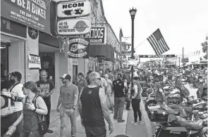  ?? SCOTT OLSON/GETTY IMAGES/TNS ?? More than 500,000 people flocked to this year’s motorcycle rally in Sturgis, South Dakota.