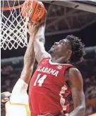  ?? BRIANNA PACIORKA/KNOXVILLE NEWS SENTINEL ?? Alabama center Charles Bediako goes up for a dunk against Tennessee on Wednesday.