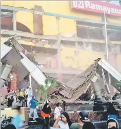  ?? — Reuters photo ?? A shopping center heavily damaged following the earthquake in Palu.