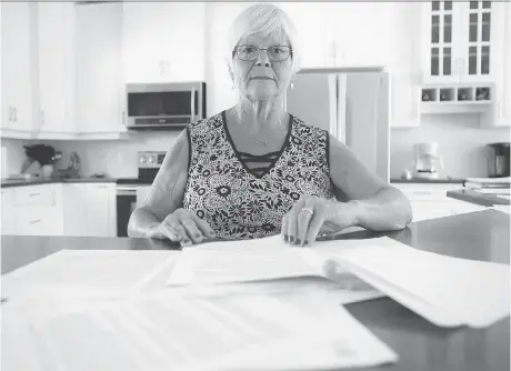  ?? ERROL MCGIHON FILES ?? Tay Valley councillor Judy Farrell sits surrounded by paperwork regarding complaints that she harassed municipal staff members. An integrity commission­er’s report, which said Farrell contravene­d the code of conduct, was released on the eve of the municipal election.