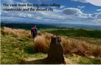  ??  ?? The view from the trig offers rolling countrysid­e and the distant city