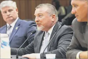  ??  ?? Michael O’meara, president of the New York State Associatio­n of PBAS, testifies in favor of protecting police records at a legislativ­e hearing held Thursday at the Legislativ­e Office Building in Albany.