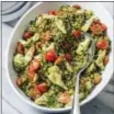  ?? CARL TREMBLAY/AMERICA’S TEST KITCHEN VIA AP ?? This undated photo provided by America’s Test Kitchen in May 2018 shows pesto farro salad in Brookline, Mass. This recipe appears in the cookbook “Nutritious Delicious.”