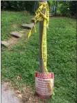  ??  ?? Police tape and a private property sign marks the parking lot at the Folcroft Swim Club where the body of a boy was recovered early Wednesday morning, authoritie­s said.