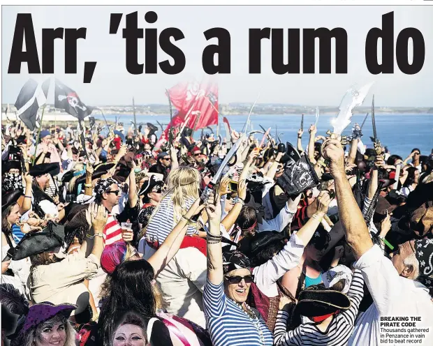  ??  ?? BREAKING THE PIRATE CODE Thousands gathered in Penzance in vain bid to beat record