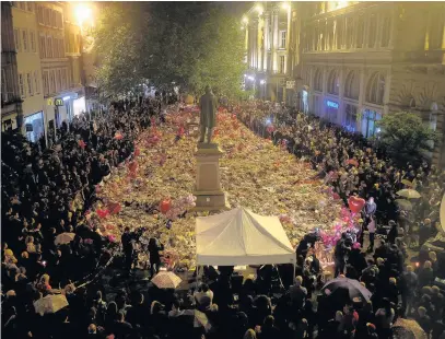  ??  ?? ●●Hundreds of people gathered in St Ann’s Square, Manchester for a vigil to mark a week since the Manchester bombing