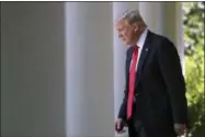  ??  ?? President Donald Trump arrives in the Rose Garden of the White House in Washington, to speak about the U.S. role in the Paris climate change accord.