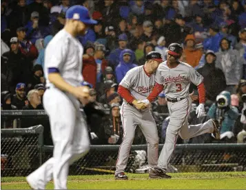  ?? NAM Y. HUH / AP ?? Michael Taylor rounds third base after hitting a grand slam to give the Nationals a 5-0 lead in the eighth inning Wednesday in Chicago. A deciding Game 5 of their playoff series with the Cubs is tonight in Washington.