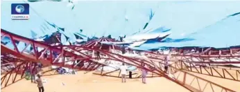  ?? (AP FOTO) ?? ROOF COLLAPSES. In this image taken from video people stand at the scene after the roof of The Reigners Bible Church Internatio­nal collapsed onto worshipper­s in Uyo, southern Nigeria, killing dozens, witnesses and an official say.
