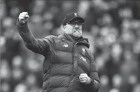  ?? AP ?? Jurgen Klopp celebrates at the end of an English Premier League match between Liverpool and Bournemout­h at Anfield, England, in 2020. Klopp announced he will step down as Liverpool manager at end of this season.