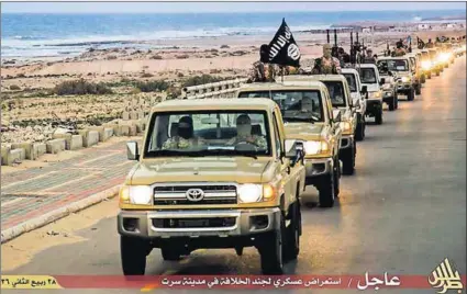  ?? Photo: Welayat Tarablos/AFP ?? Atrocities: An image made available by Islamist propaganda outlet Welayat Tarablos allegedly shows members of the Islamic State parading in a street in Libya’s coastal city of Sirte.