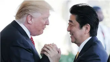  ?? MARIO TAMA/ GETTY IMAGES ?? U. S. President Donald Trump, with Japanese Prime Minister Shinzo Abe at the White House on Friday, requires a strategy of containmen­t, writes Andrew Coyne.