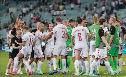  ??  ?? Denmark’s players celebrate after winning the UEFA EURO 2020 quarter-final against Czech Republic at the Olympic Stadium in Baku on Saturday.
