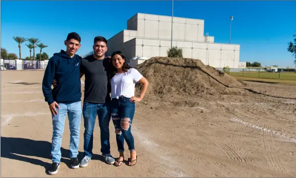  ??  ?? southwest High school swimmers eric Pompa (left), Jonathan Puga and Alice swimming pool is set to be built starting in 2019 with funds from measure k. Valle pose where a new eight-lane competitio­n