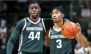  ?? AL GOLDIS —THE ASSOCIATED PRESS ?? Michigan State’s Jaden Akins, right, a Farmington native, and Gabe Brown dribble out the clock at the end of Wednesday’s game against High Point. Brown finished with a career-high 24points as the Spartans won, 81-68.