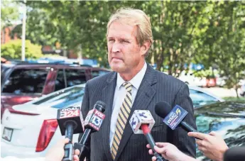  ?? COMMERCIAL APPEAL ?? Kevin Kane, president of Memphis Convention and Visitors Bureau, speaks with local media before the start of Phil Trenary's funeral services at Christ United Methodist Church. BRAD VEST/THE