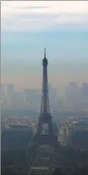  ?? FRANCOIS MORI / AP ?? Smog obscures the Eiffel Tower on Wednesday as Paris saw its worst pollution in a decade.