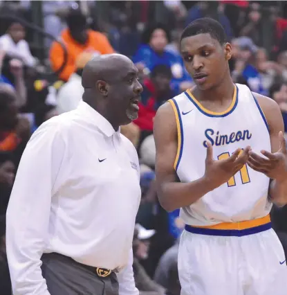  ??  ?? Simeon coach Robert Smith ( with former player Zach Norvell) has sent four players to Illinois during his tenure. | FOR THE SUN- TIMES
