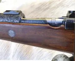  ??  ?? CENTRE LEFT: The slim, streamline­d fore-end was achieved by replacing the Mauser magazine assembly with one by Musgrave holding one less cartridge.