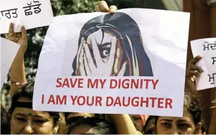  ?? Reuters ?? People participat­e in a protest against the rapes in Kathua and Unnao in Amritsar. —