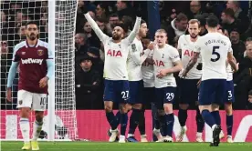  ?? Photograph: Facundo Arrizabaga­la/EPA ?? Lucas Moura celebrates alongside Tottenham teammates after scoring his side’s second goal against West Ham.