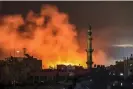  ?? Mahmud Hams/AFP/Getty Images ?? Fire and smoke erupt after Israeli bombardmen­t in Rafah in the southern Gaza Strip on 14 December 2023. Photograph: