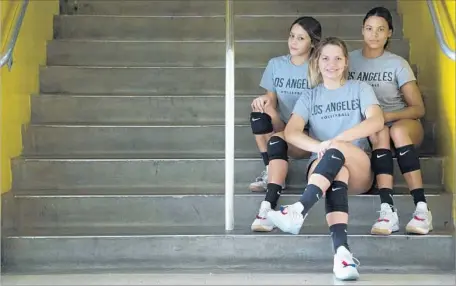  ?? Photograph­s by Myung J. Chun Los Angeles Times ?? CAL STATE L.A. volleyball players Jeshmarie Suarez, left, Alejandra Negron and Karla Santos have family members in Puerto Rico.