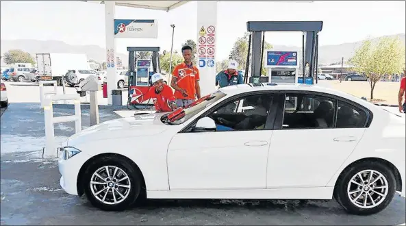  ?? Picture: SUPPLIED ?? WAY TO GO: Komani Caltex workers who were trained as tourism ambassador­s, show off the informatio­n they learnt during a training session on Wednesday