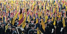  ??  ?? Standard bearers, veterans, members of the Armed Forces and family members gather at the Menin Gate for the British Legion’s ‘One Hundred Days’ event in Ypres, Belgium