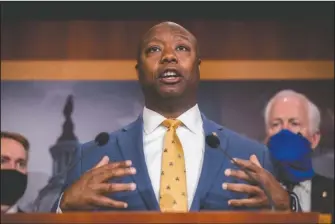  ?? The Associated Press ?? SPEAKING: Sen. Tim Scott, R-S.C., accompanie­d by Republican senators speaks at a news conference to announce a Republican police reform bill on Capitol Hill on June 17, in Washington. Initially reluctant to speak on race, Scott is now among the Republican Party’s most prominent voices teaching his colleagues what it’s like to be a Black man in America.