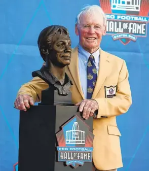  ?? RON SCHWANE AP ?? Bobby Beathard, who wore many hats in his NFL career including general manager of the Chargers, poses with his bust after being inducted into the Pro Football Hall of Fame.