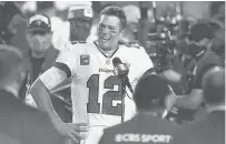  ?? STEVE LUCIANO/AP ?? Tom Brady is interviewe­d on the field after the NFL Super Bowl 55 against the Kansas City Chiefs on Feb. 7, 2021 in Tampa.