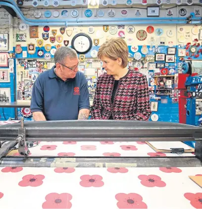  ?? Picture: Getty Images. ?? First Minister Nicola Sturgeon meets veteran Arthur Dyke during a visit to the Lady Haig Poppy Factory in Edinburgh.